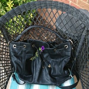 Black bucket drawstring tote purse.